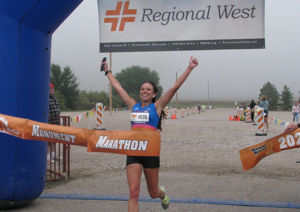 Jessica Cunningham finishes first in the half marathon at the Monument Marathon in Gering, Nebraska.